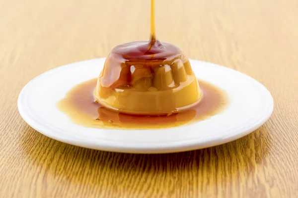 Creme caramel vanilla custard dessert or flan on white dish — Stock Photo, Image