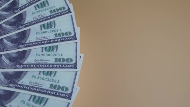 100 dollars bills rotating on the table. Rotation of money. Top view, Copy space — Stock Video