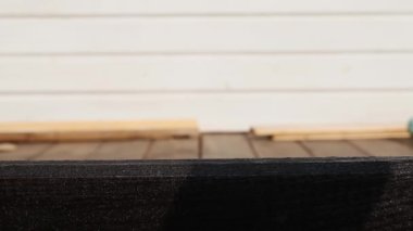 The colorful horizontal level is neatly placed on a wooden surface. Close-up