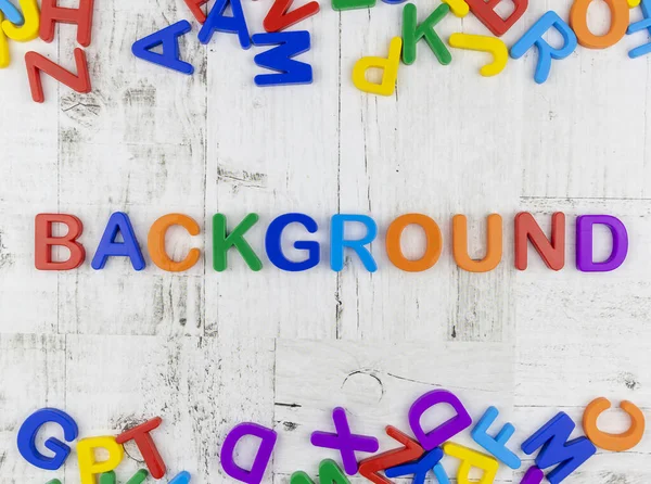 Word - Background - in bright colorful alphabet letters. Flat lay, top view