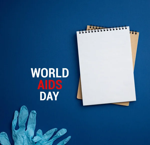Notepad with medical gloves World AIDS Day concept