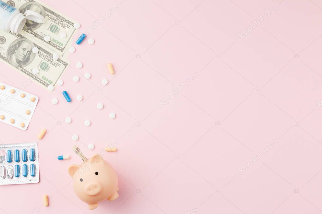Piggy bank with money and pills on flat background