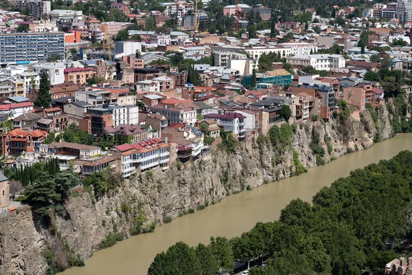 Downtown Tbilisi from above with the Kura river and the houses and cliffs above it