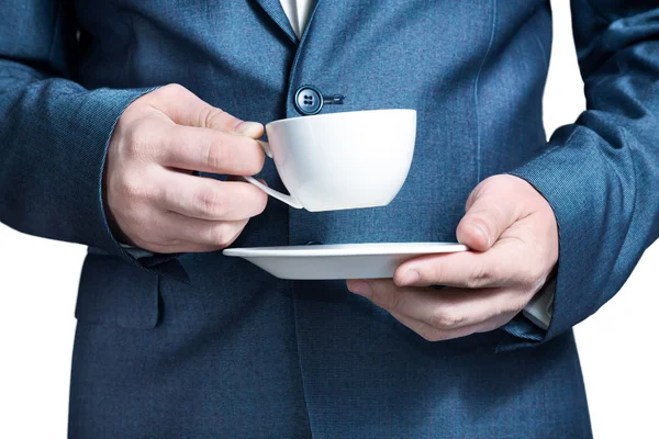 Man i jacka håller en kopp kaffe — Stockfoto