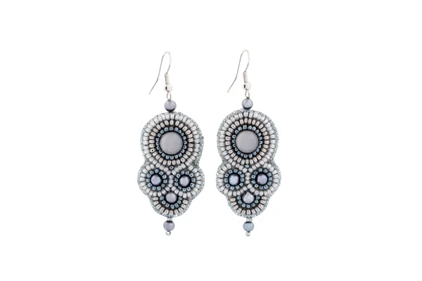 Earrings made of gray beads with stone — Stock Photo, Image