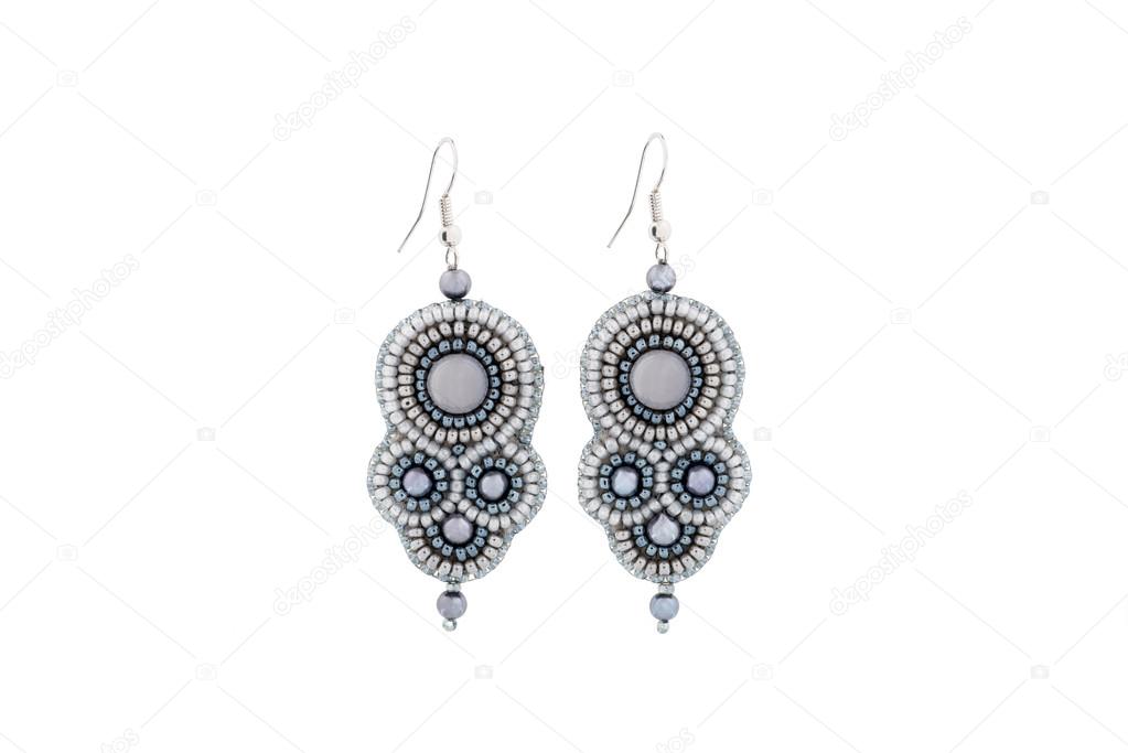 Earrings made of gray beads with stone