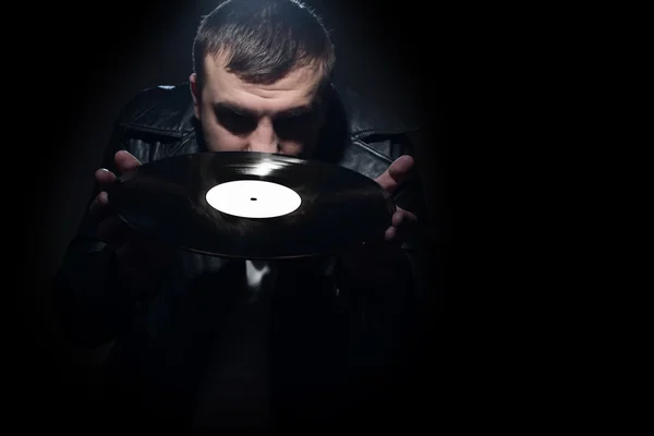 Musical record. Man holds in his hands the music record — Stock Photo, Image