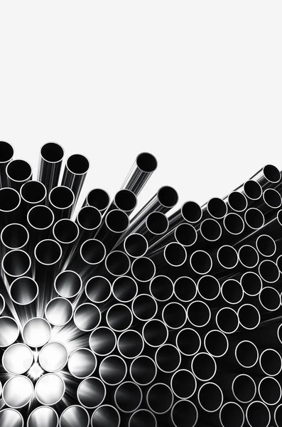 Close-up of metal pipes on a white background. A pile of iron pipes isolated on a white background. 3d render illustration