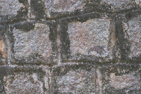 O velho muro do Templo. Pedra de superfície real de tijolo de granito de mármore recortado retangular com cimento. Padrão cor cinza fundo textura rústica. Site de design. Humor sombrio sombrio e sombrio. Mais tom em estoque — Fotografia de Stock
