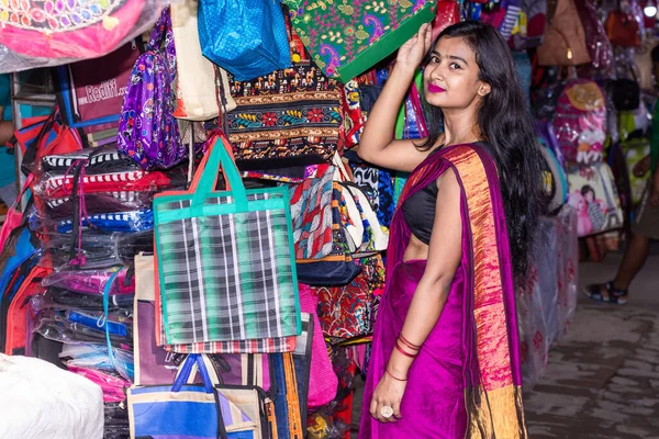 Beautiful Indian woman doing shopping in traditional sari for festival season