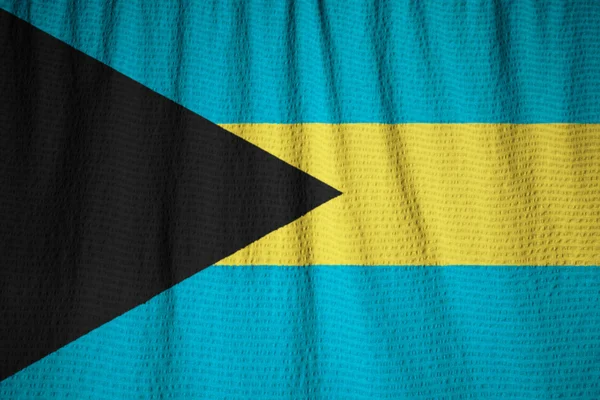 Primer plano de la bandera de Bahamas con volantes, bandera de Bahamas soplando en el viento — Foto de Stock