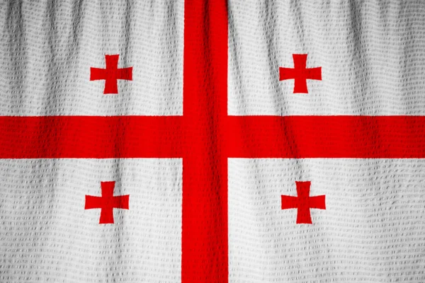 Gros plan du drapeau de Géorgie froissé, drapeau de Géorgie soufflant dans le vent — Photo