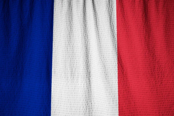Closeup prohrábl Francie vlajka, Francie vlajka vlající ve větru — Stock fotografie