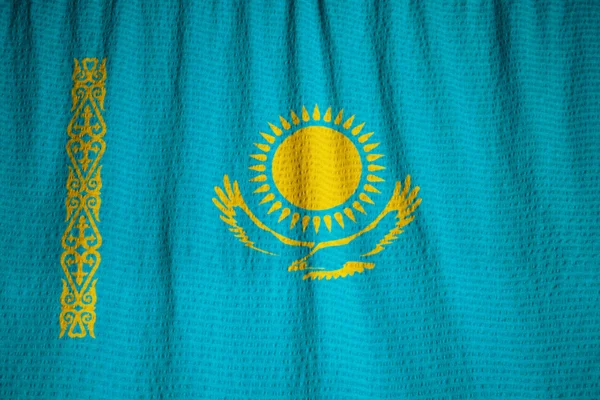 Närbild av ruggig Kazakstan flagga, Kazakstan flagga — Stockfoto