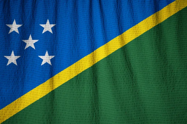 Closeup z prohrábl Šalamounových ostrovů vlajka, Šalamounovy ostrovy — Stock fotografie