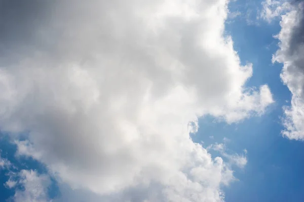 Scattered cloud clusters in a blue sky, blue sky background with white clouds,