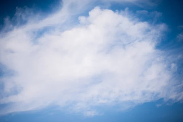 Scattered cloud clusters in a blue sky, blue sky background with white clouds,