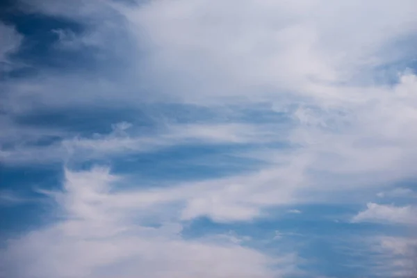 Scattered cloud clusters in a blue sky, blue sky background with white clouds,