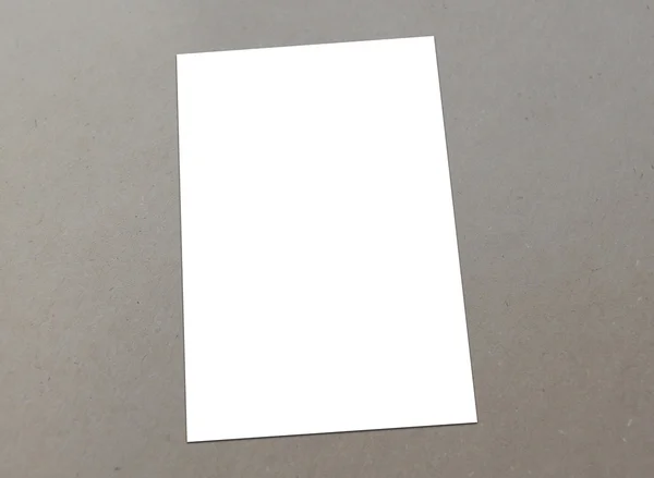 Blank white paper A-4 flyer collection on floor — Stock Photo, Image