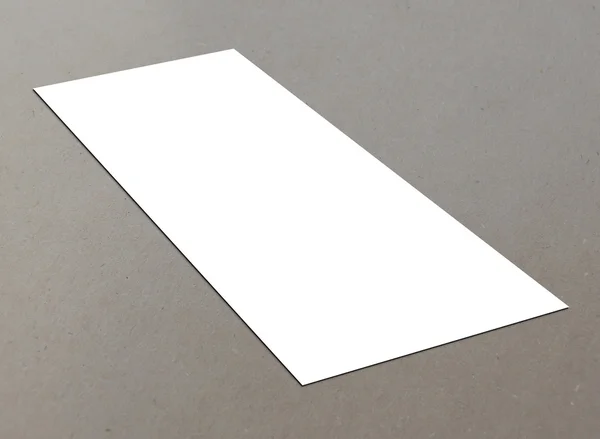 Blank white paper (4"x 8") flyer on floor — Stock Photo, Image