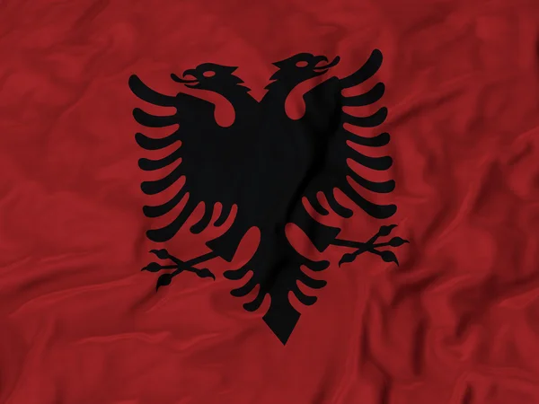 Nahaufnahme einer zerzausten Albanien-Flagge — Stockfoto