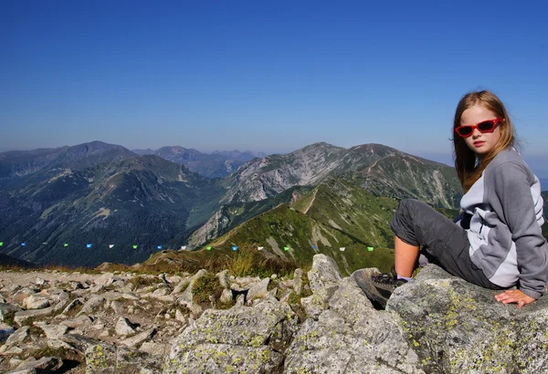 Girl sitting on a rock in Tatra — Stock Photo, Image