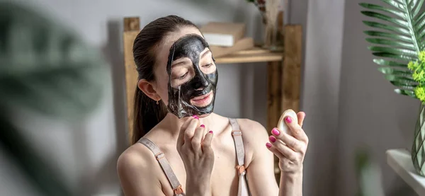 Young Woman Holding Mirror Her Hand Removing Cosmetic Black Mask — Stock Photo, Image