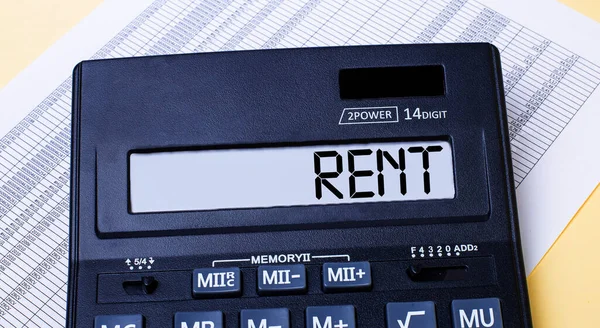 Uma Calculadora Rotulada Rent Está Mesa Perto Relatório Conceito Financeiro — Fotografia de Stock