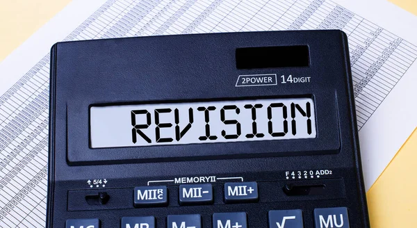 Calculator Labeled Revision Table Report Financial Concept — Stock Photo, Image