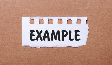 Kahverengi arkaplanda, beyaz kağıtta Example yazılıdır.