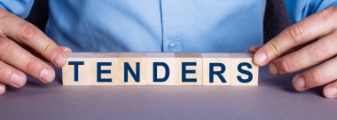 TENDERS kelimesi bir insan tarafından tahtadan yapılmış küplerden oluşur. İş konsepti