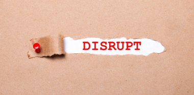 Beneath the torn strip of kraft paper attached with a red button is a white paper labeled DISRUPT clipart