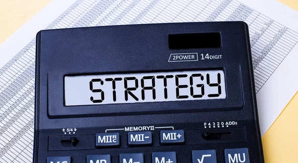 Una Calculadora Llamada Estrategia Está Sobre Mesa Cerca Del Informe —  Fotos de Stock