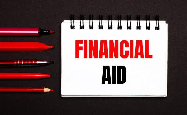 White Notepad Text Financial Aid Written White Notepad Next Red — Foto de Stock