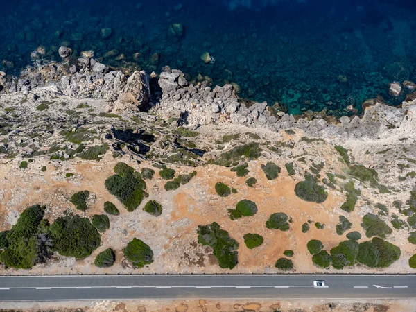 cars in bird\'s eye view on Carretera Militar, Cap Blanc, Llucmajor, Mallorca, Balearic Islands, Spain