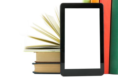 Stack of colorful books and electronic book reader. Electronic library concept. Back to school. Copy space