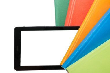 Stack of colorful books and electronic book reader. Electronic library concept. Back to school. Copy space