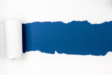Ripped paper, ragged sheets of paper, Copy space bluebackground.