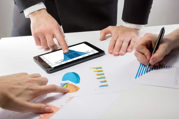 Business people on a meeting analyzing financial reports — Stock fotografie