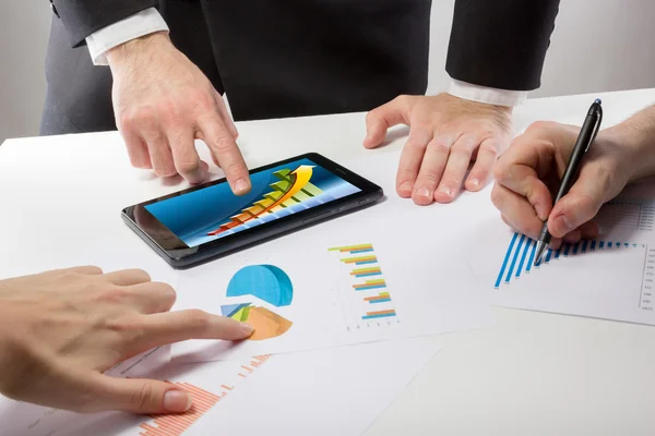 Business people on a meeting analyzing financial reports — Stock Fotó