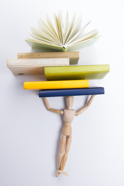 A stack of colorful books, open book. Back to school