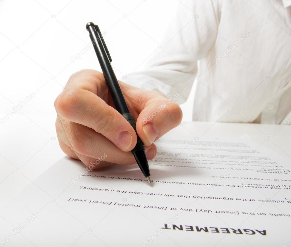 Businessman's hand signing papers. Lawyer, realtor, businessman 