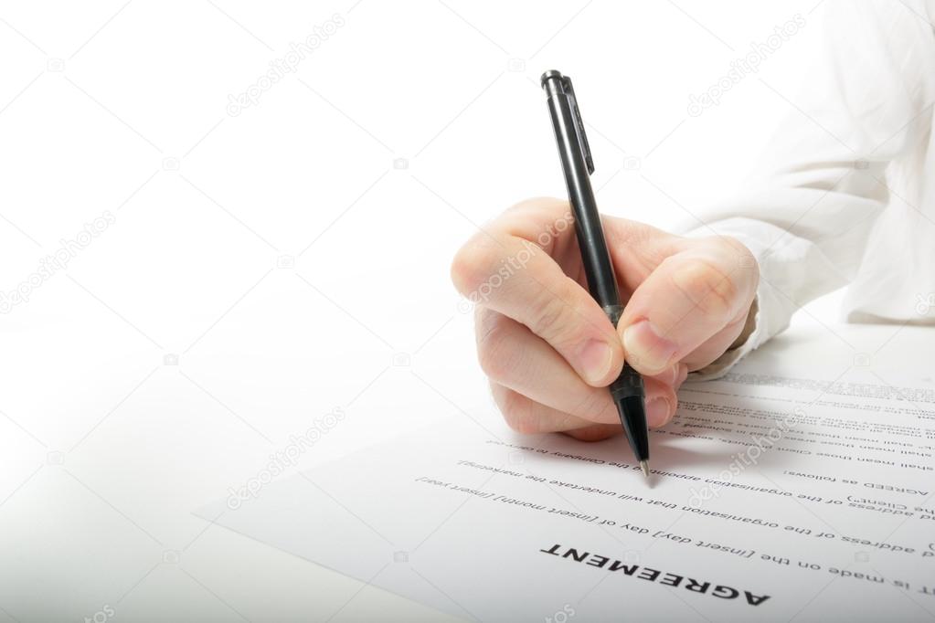 Businessman's hand signing papers. Lawyer, realtor, businessman sign documents on white background. Copy space for text.