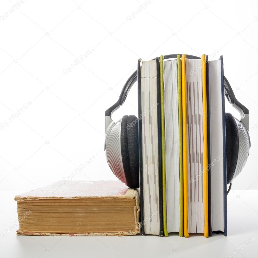 Audiobook concept. Books and headphones. 