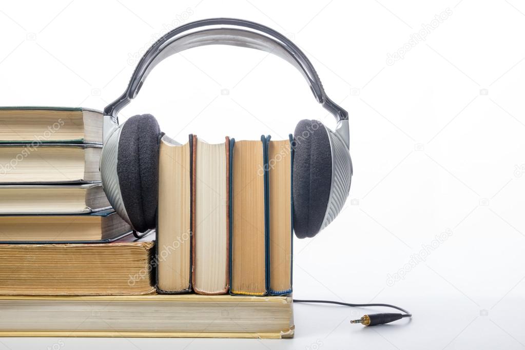 Audiobook concept. Books and headphones. 