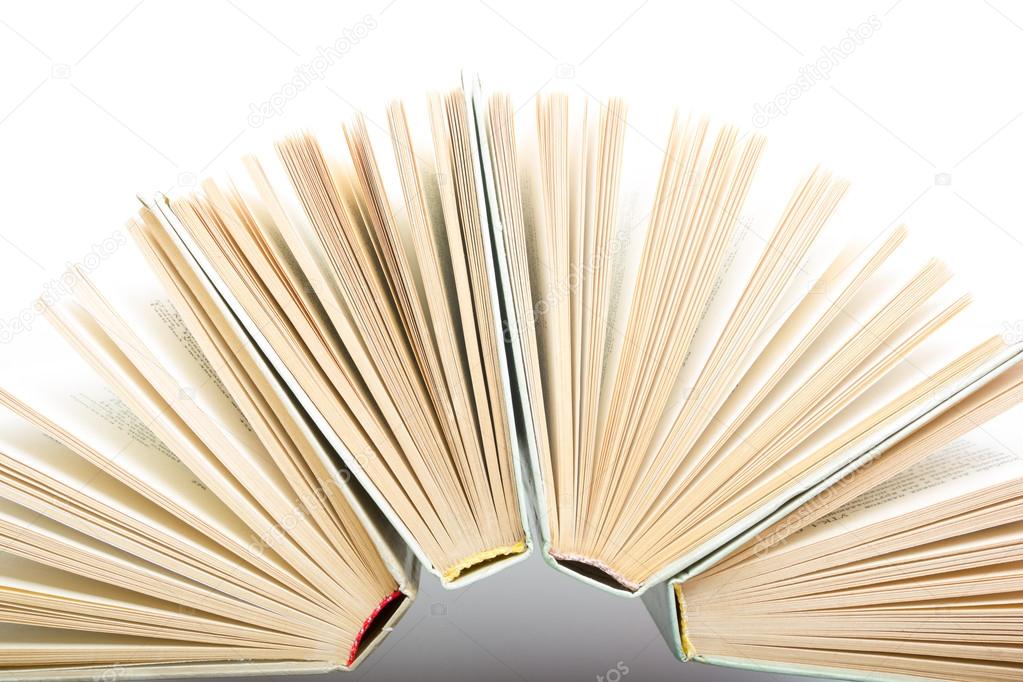 Top view of hardback books in a circle isolated on white. Back to school