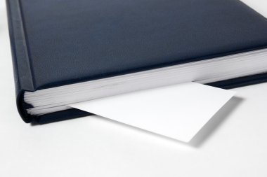 Business card as a bookmark in the book, diary