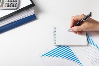 Businessman counting losses and profit working with statistics, analyzing the results