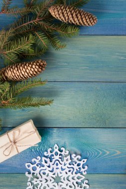 Christmas rustic background - vintage planked wood with Christmas fir tree and free text space. Winter holidays concept. Copy space for your text. Merry Christmas and happy new year!