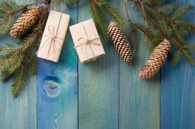 Christmas rustic background - vintage planked wood with Christmas fir tree and free text space. Winter holidays concept. Copy space for your text. Merry Christmas and happy new year!